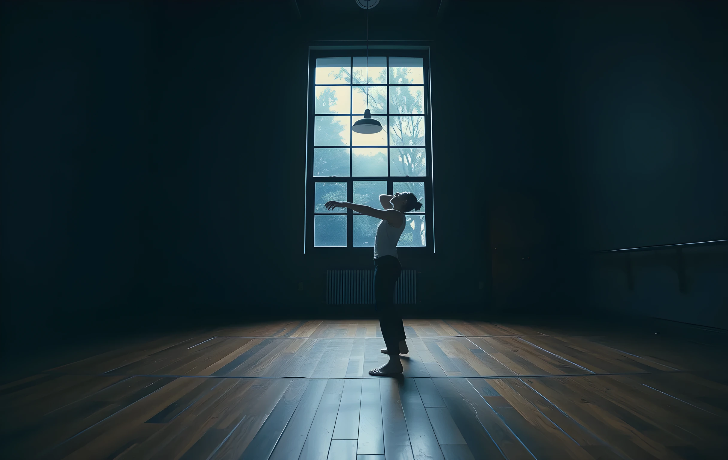 A medium-wide view inside an empty rehearsal studio after hours, a lone actor practices movement under a tall window where streetlamp glow spills across scuffed wooden floors, dust motes suspended in the cool blue light, focus on the performer’s posture and the expansive room